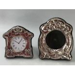 Hallmarked silver framed clock and a hallmarked silver photo frame