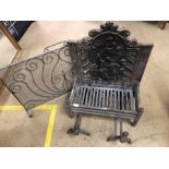 Antique fire grate with incorporated fire back, two fire dogs and a wrought iron mesh fire screen
