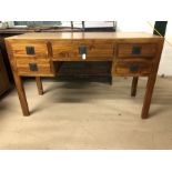 Modern light oak desk of five drawers on square legs, approx 50cm x 130cm x 80cm tall