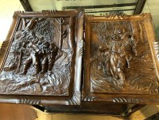 Pair of carved wooden panels, the larger approx 40cm x 32cm