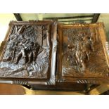 Pair of carved wooden panels, the larger approx 40cm x 32cm