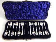 Set of Hallmarked 1905 Silver twelve teaspoons and sugar tongs in in blue velvet and silk