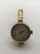 Ladies 9ct 375 Gold watch, circular dial marked Sir John Bennett London