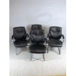 Set of four heavily upholstered black and chrome chairs