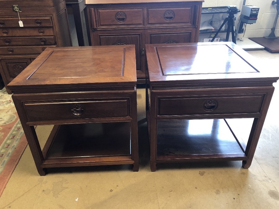 Pair of Imported Chinese rosewood side tables with carved detailing, drawer and shelf under,