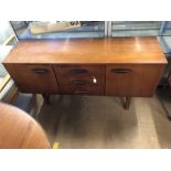 Mid-century small sideboard on legs with two drawers and two cupboards