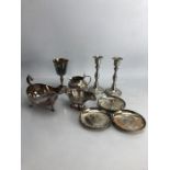 Collection of Silver plated items to include a pair of candlesticks, sauce boats, pin dishes etc...