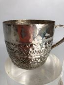 An attractive Silver cup crudely embossed (approx 47g) approx 5.5cm tall