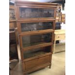Five section Globe Wernicke English-made bookcase with metal bindings, stands approx 183cm tall,