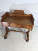 Pine washstand with two drawers and turned stretcher on bun feet