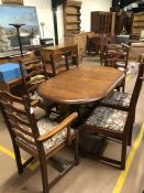 Oak oval modern extending dining table with six matching upholstered chairs