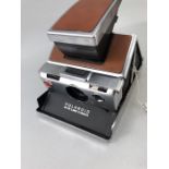 VINTAGE POLAROID SX-70 LAND CAMERA with tan leather coverings