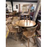 Pine circular table and four pine chairs approx 107cm in diameter