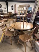 Pine circular table and four pine chairs approx 107cm in diameter