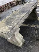 Two pedestal well weathered garden bench