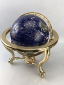 Gem set terrestrial globe upon a brass stand