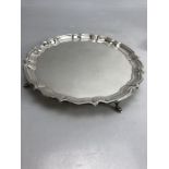 Circular Hallmarked Silver tray on four pad feet hallmarked Chester 1920 approx 348g
