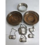 Collection of wine coasters and pewter spirit bottle labels to include, gin, scotch, sherry &