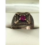 9ct Gold ring (marked 9ct) set with a single red stone size 'S' approx 5.5g