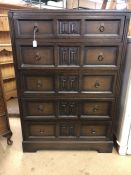 Oak chest of five drawers with carved detailing, approx 123cm tall