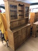 Large pine dresser with two glazed cupboards and shelves over, three drawers and cupboards under,