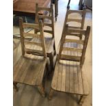 Set of four wooden slatted ladder back chairs