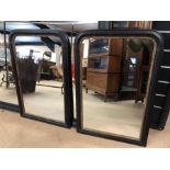 Pair of black and gold gilt framed mirrors, approx 90cm x 60cm