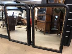 Pair of black and gold gilt framed mirrors, approx 90cm x 60cm
