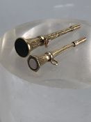 Two Gold coloured watch fob keys/ seals