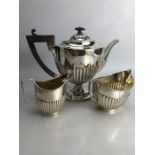 Silver hallmarked three piece tea set to include a large teapot (approx 702g) milk jug (approx 103g)