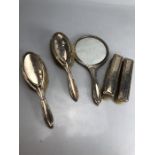 Silver all English hallmarked Dressing table set comprising four brushes and a mirror