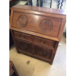 Imported Chinese rosewood bureau with carved detailing, two drawers and two cupboards under