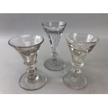 Three late 18th century squat ale or cordial glasses with clear tapering bowls and snapped pontils