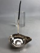 Georgian Silver toddy ladle with twisted handle and a George II coin inset to the bowl