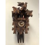 A three-train Black Forest cuckoo clock with musical hour and half-hour cuckoo chimes