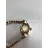Hallmarked vintage ladies starburst face watch with 9ct Gold watch case and expanding bracelet