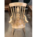 Pine rocking chair with slat-back detail