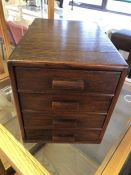 Four drawer oak desktop filing cabinet, approx 33cm x 23cm x 26cm tall