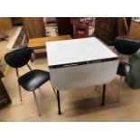 Small melamine-topped drop leaf retro kitchen table with with two black padded, chrome-legged