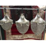 Set of three graduating acorn chandeliers with silver coloured frames and glass beading. Largest