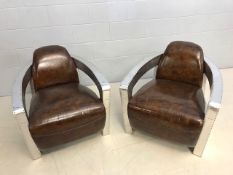 Pair of club chairs in an aviator style, approx 75cm wide x 90cm deep x 75cm tall