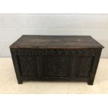 18th Century heavily carved three panel oak coffer with three plank lid, approx 107cm x 45cm x