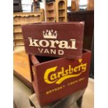 Two vintage painted wooden crates, one marked Koral Vand, the other Carlsberg