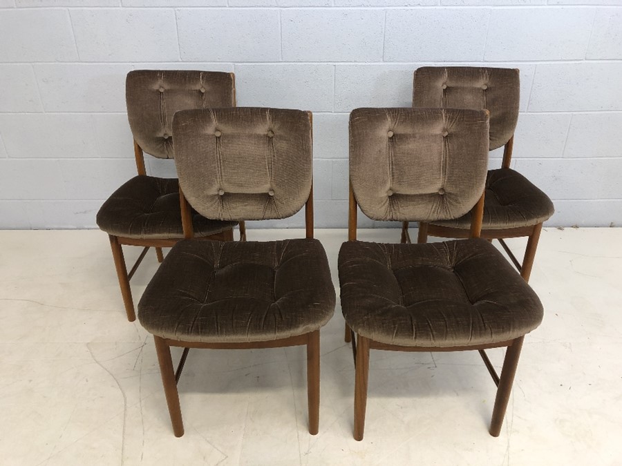 Set of four Mid Century teak chairs with padded seats and backs