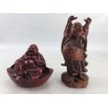 Two Buddha figurines one carved wooden and one Cinnabar