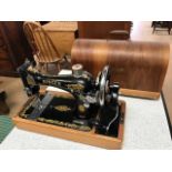 Cased Singer sewing machine with range of original accessories, model number EL826159