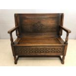 Carved oak folding monks bench with hinged seat, approx 106cm in length