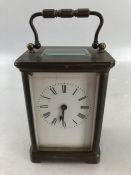 Small brass carriage clock with ceramic dial approx 11cm tall