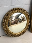 Porthole style mirror with ornate gilt frame, approx 60cm in diameter