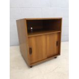 Mid Century teak music / record cabinet with sliding doors, on castors